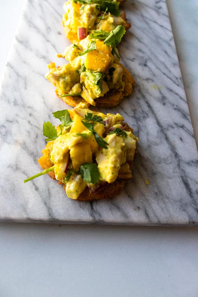 chicken mango salad bites on top of a marble surface