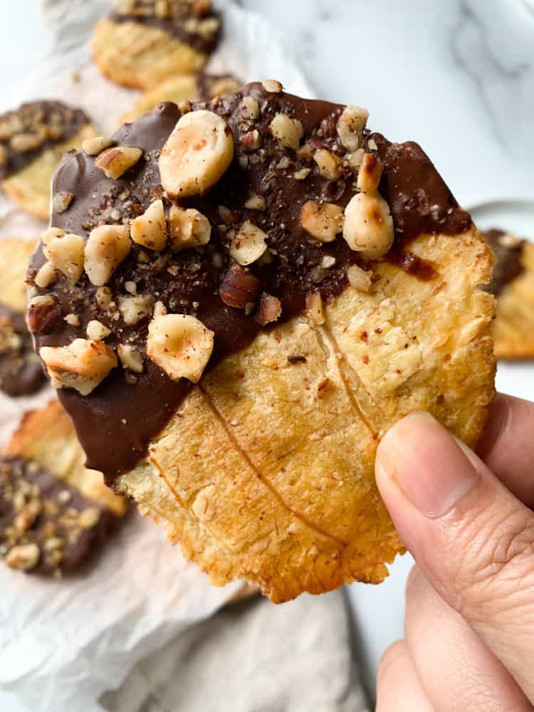 chocolate hazelnut tostones being held up