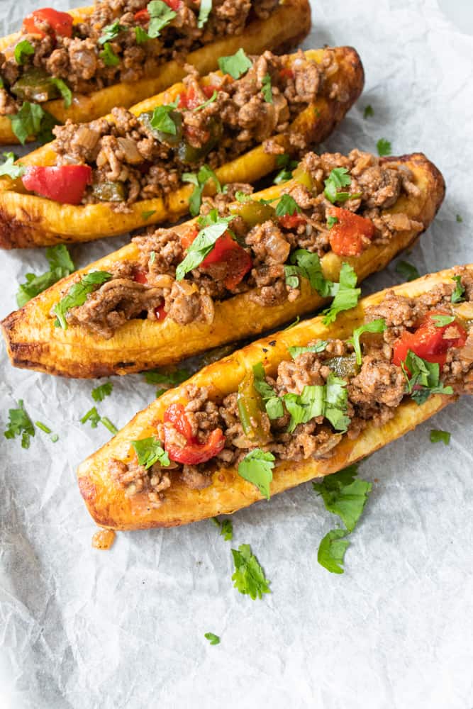 four stuffed plantains on a platter