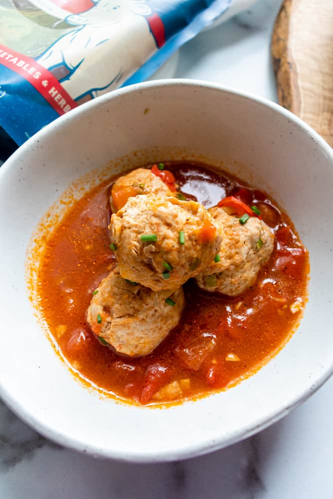 vietnamese meatballs (xiu mai) in a bowl with the sauce