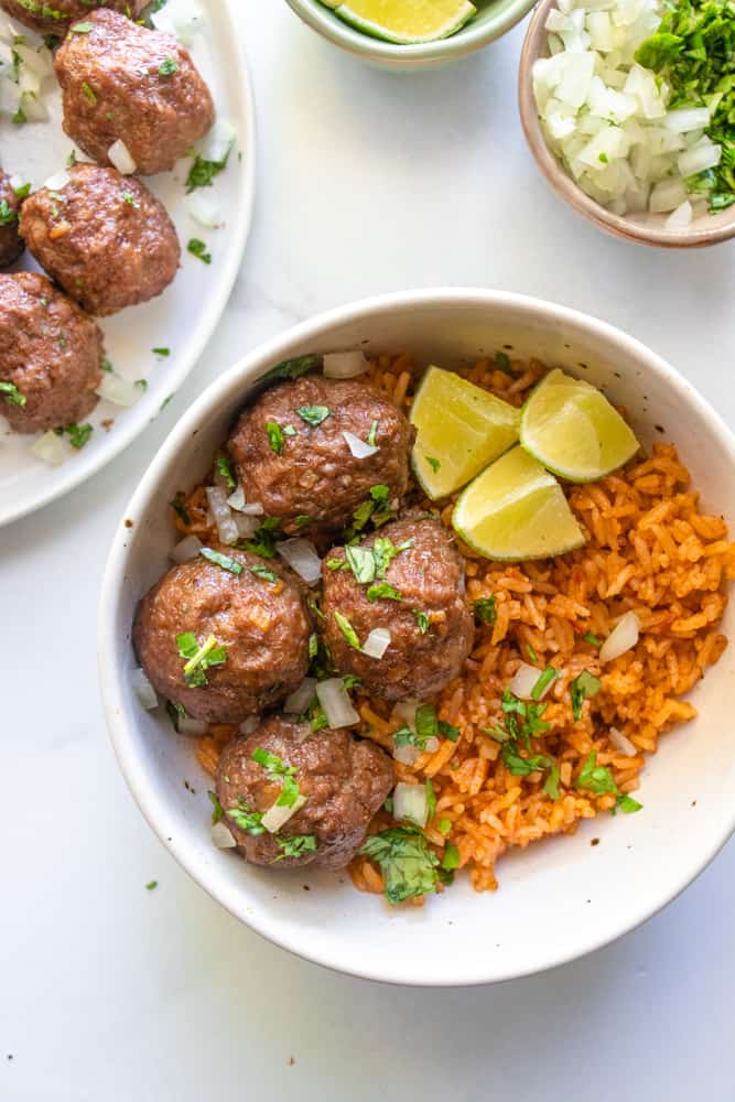 street taco meatballs over a bowl mexican rice