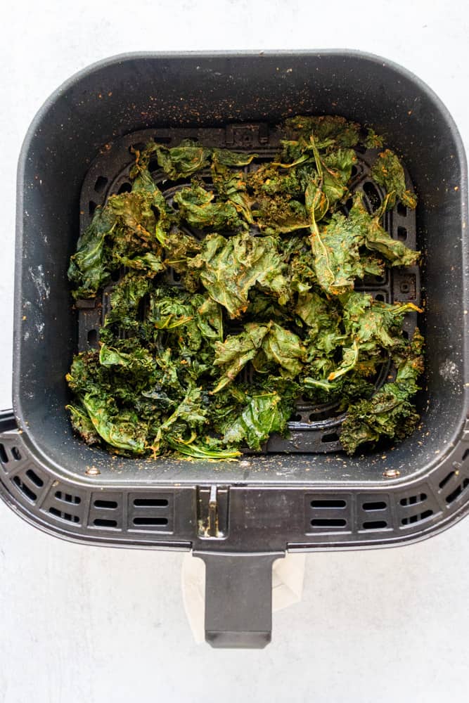 air fryer kale chips in an air fryer basket