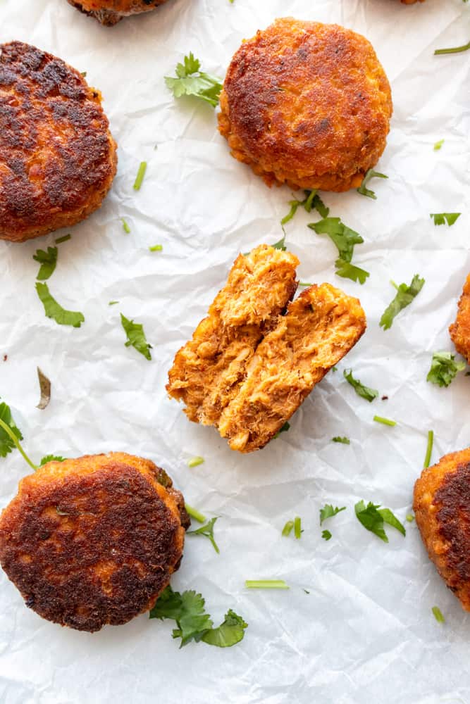 one of the red curry salmon cakes is split in half to show inside