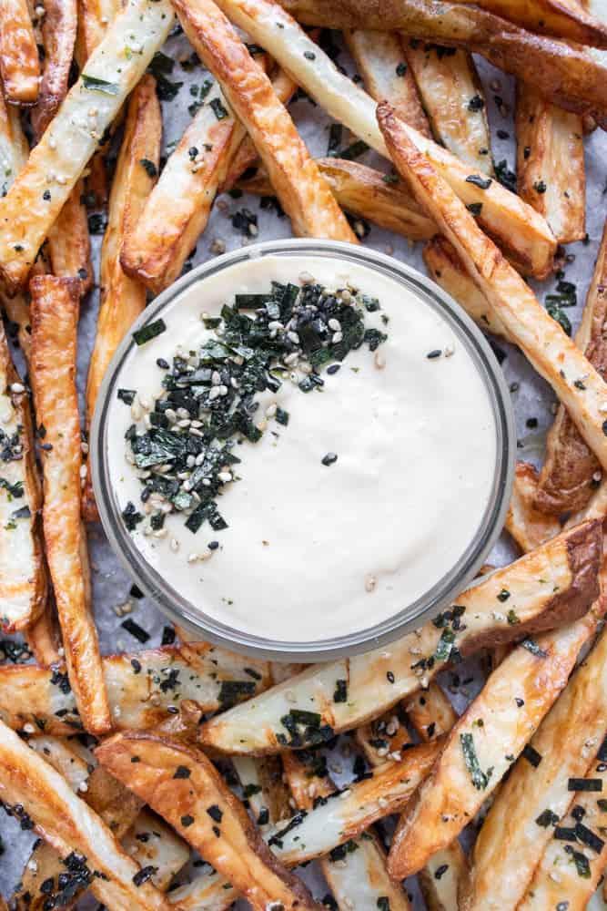 furikake french fries on a platter with a close up of the dipping sauce