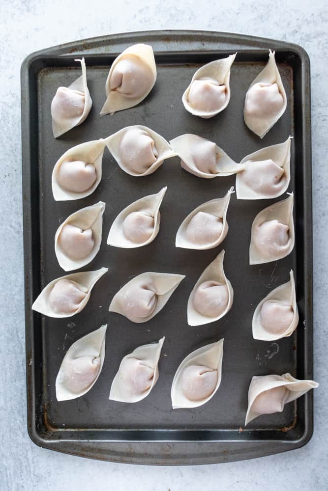 easy wonton soup dumplings on a tray ready to be frozen