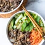 two bowls of bun bo xao (vietnamese lemongrass beef noodle) with chopsticks