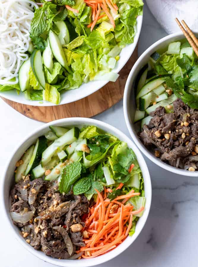 two bowls of bun bo xao (vietnamese lemongrass beef noodle)