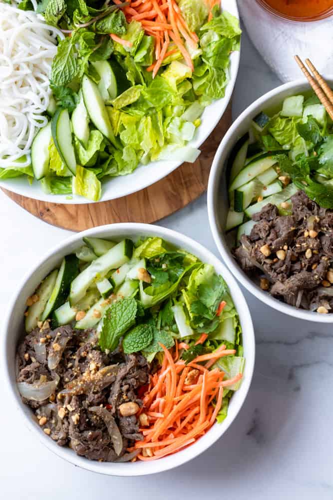 two bowls of bun bo xao (vietnamese lemongrass beef noodle)