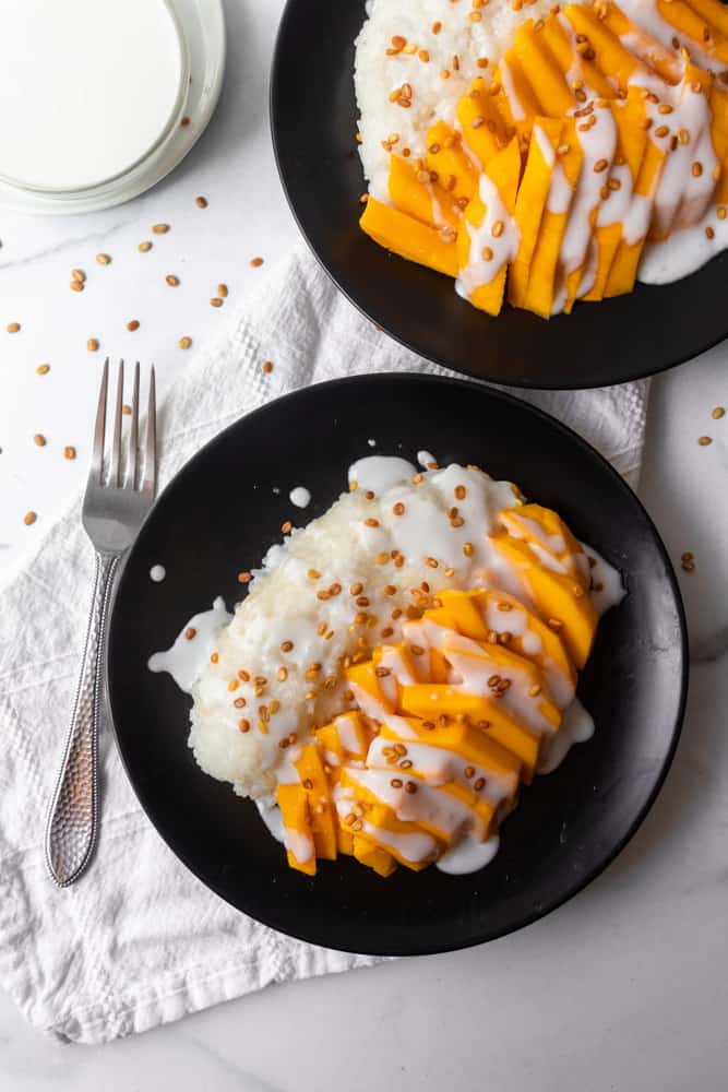 two plates of mango sticky rice