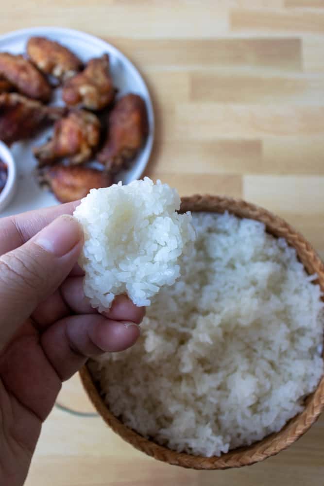 sticky rice (khao niew) being made into a rice ball