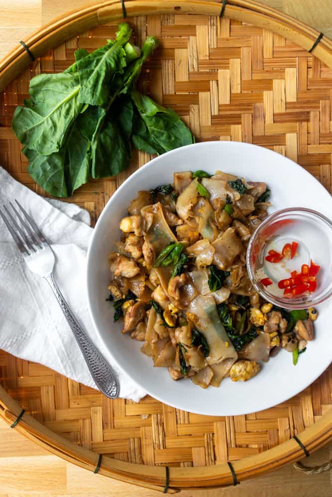 overview of the pad see with chinese broccoli next to the plate