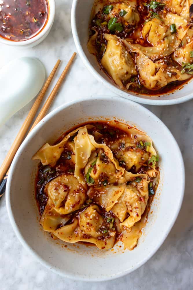 Takeout Container Of Chinese Wonton Soup With Chopsticks On A