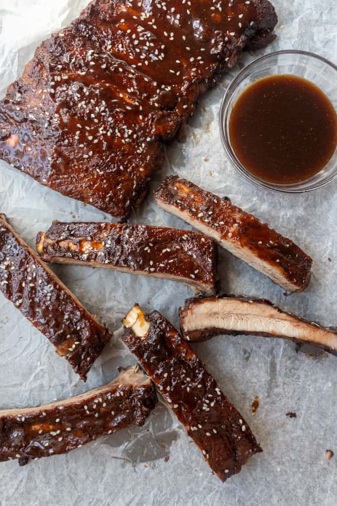 Chinese Five Spice Ribs with extra sauce on the side and some are sliced