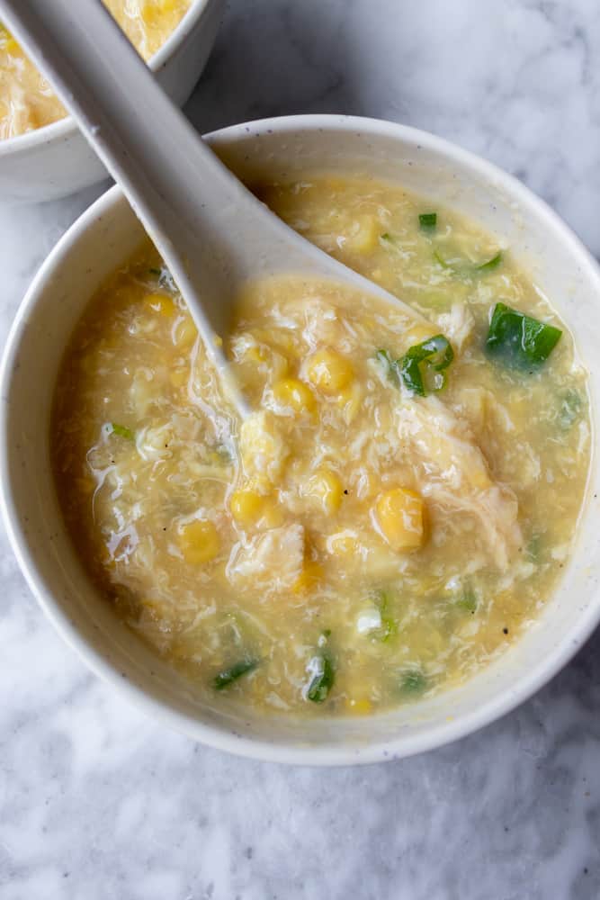 a bowl of Chinese Chicken and Corn Soup mixed up