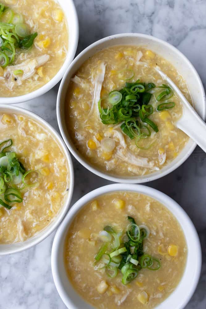 overview of four bowls of Chinese Chicken and Corn Soup